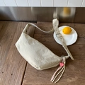 Beige crescent crossbody bag in pleated nylon with heart charm and woven tassels - Off-white