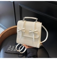 Chic creamy white backpack in wrinkled PU leather with dual 3D ribbon bows and top handle - White