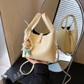 Chic cream bucket handbag with pearl Labubu charm and adjustable crossbody strap - Yellow with Pendant