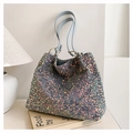 Detail of shimmering sequins on large tote bag with metallic ring and blue shoulder strap - Blue
