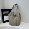 Minimalist khaki tote bag with multi-pocket design and snap closures for casual daily use - Khaki