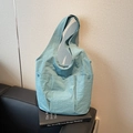 Light blue nylon tote bag with three exterior pockets and decorative resin buttons - Blue