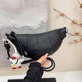 Black lychee leather croissant bag with knotted strap and cute duck pendant - Black with Pendant