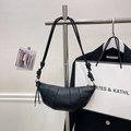 Minimalist black croissant bag in pebbled leather with unique knot strap detail - Black without Pendant
