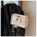 Detailed shot of white quilted bag featuring silver double zippers and camellia charms - S / White