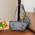Grey-blue woven fabric tote bag with leather knot handles and metallic zipper detail - Blue