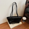 Sac fourre-tout noir minimaliste en cuir avec fines brides et détails de nœuds - Noir