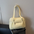 Minimalist cream yellow faux leather hobo bag with top handles and brand embossing - Yellow