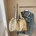 Minimalist beige nylon tote bag with drawstring closure and dual front pockets - Khaki