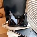 Minimalist black oil-wax leather crescent bag with silver hardware and sleek shoulder strap - Black without Pendant