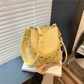 Creamy yellow lychee grain bucket bag with bold chain and adjustable strap - Yellow