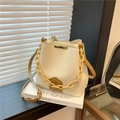 Cream and brown bucket bag with a chunky chain handle and litchi texture finish - Beige