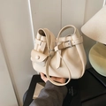 Creamy beige lychee texture leather bucket bag with cross-strap buckle and shoulder strap - White