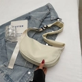 Minimalist beige half-moon crossbody bag with wide padded shoulder strap in matte nylon - No Pendant / Off White
