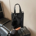 Mini black patent leather tote bag with teddy bear charm and adjustable crossbody strap - Black