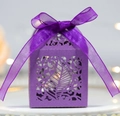 Detail of purple laser-cut leaf pattern gift box with elegant ribbon bow and pearl finish - Dark Purple