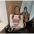 White tote bag with 3D cartoon bear detail and wide strap on dark wood surface - Cream White with Coffee