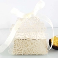 Detailed laser-cut rose patterns on hollow gift box with satin ribbon and chocolate - Ivory