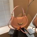 Pink crescent leather handbag with lychee texture and golden metal buckle accessory - Pink