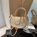 Creamy white lychee texture leather saddle bag with gold metal buckle and dual straps - Off White