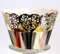 Macro shot of laser-cut heart pattern silver cupcake wrapper with silver metallic finish - Reflective Silver