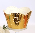 Detail showing the laser-cut rose patterns and mirror gold finish of cupcake wrappers - Reflective Gold