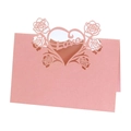 Close-up of pink laser-cut wedding place card with rose design and Love cutout - Pink