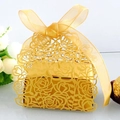 Detailed laser-cut gold wedding favor box featuring rose hollow design and ribbon bow - Gold