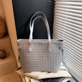 Silver woven tote bag with metallic finish and thin handles in a stylish commute design - Silver