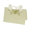 Detail of laser-cut heart and rose design on iridescent light green wedding place card - Emerald Green