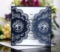 Detail of navy laser cut wedding invitation with lace pattern and white inner sheet - Ink Blue