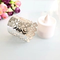 Silver laser-cut hollow candle wrap with floral pattern and white LED electronic candle - Reflective Silver