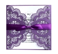 Detail of laser-cut purple lace invitation with a deep violet satin ribbon bow - Dark Purple