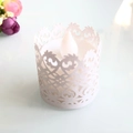 White laser-cut decorative paper wrap for LED candles featuring floral vine patterns - White