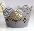 Macro shot of silver laser-cut cupcake liner with elegant hollow wave pattern detail - Silver Charcoal