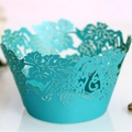Laser-cut cupcake wrappers with intricate grape vine design in vibrant lake blue color - Tiffany Blue