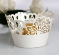 Detailed laser cut lace cake wrapper in pearl white with intricate floral hollow design - Ivory