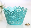 Detail of laser-cut tiffany blue cupcake wrapper with elegant baroque filigree patterns - Tiffany Blue