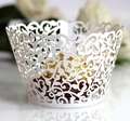 Close-up of white laser-cut cupcake wrapper with intricate lace vine pattern for wedding - 5cm / White