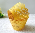 Golden laser-cut floral cupcake wrappers with intricate hollow patterns for parties - Gold