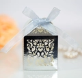Detail of silver laser-cut wedding candy box with heart patterns and light blue ribbon bow - Reflective Silver