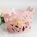 Macro detail of laser-cut pink butterfly cupcake wrapper with intricate hollow lace pattern - 5cm / Pink