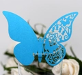 Dettaglio segnaposto a farfalla blu tagliato al laser per decorazione di calici - Celeste