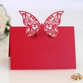 Elegant red laser-cut butterfly place cards made of pearlescent paper for wedding decor - Pearlescent Red
