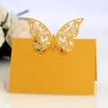 Elegant laser-cut golden butterfly place card for weddings with hollow wing pattern - Gold