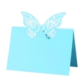Close-up of light blue laser-cut butterfly table card with intricate floral patterns - 50 Sheets / Tiffany Blue
