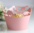 Detailed laser-cut pink dinosaur cupcake wrappers with dinosaur silhouettes for parties - Pink
