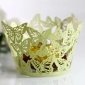 Macro view of laser-cut light green cupcake wrapper with intricate butterfly pattern - Light Green