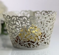 Macro view of light grey laser-cut cupcake wrapper with elegant vine filigree patterns - 5cm / Silver Gray