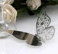 Macro shot of laser-cut hollow butterfly card with elegant silver metallic finish - 50 Pieces / Reflective Silver